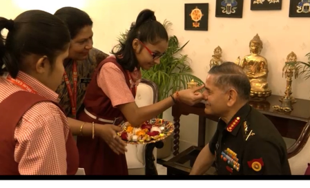 <div>Schoolgirls tie ‘rakhi’ to Army Chief; military reaffirms its pledge to protect country</div>