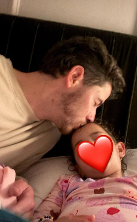 Nick Jonas shares adorable pic of him kissing little Malti Marie while putting her to sleep
