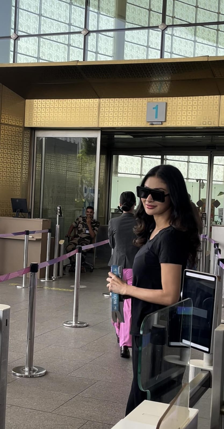 Mouni Roy apologises after accidental stumble with airport staff member